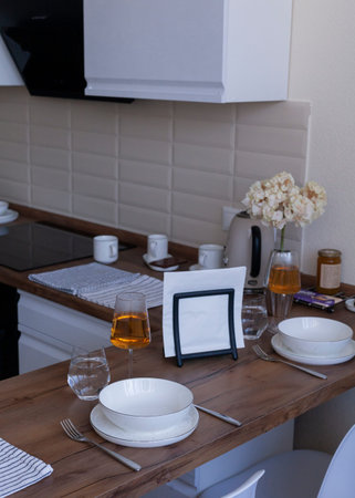 two glasses of wine are on the table at homeの写真素材