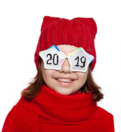 Cheerful girl with glasses with the inscription 2019 on a white background