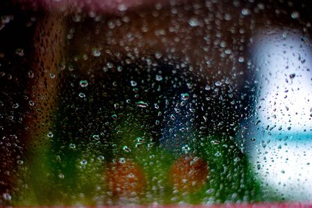 Window splashed with raindrops. Large depth of field.の写真素材