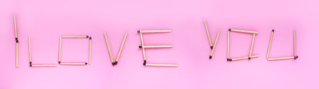 I love you, the inscription is laid out with matches on a pink background. Banner, background with a romantic inscription.の写真素材