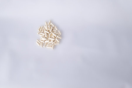 White capsules for gut health on a white background. There is space for text.の写真素材