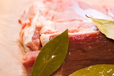 A piece of fresh meat with Laurel leavesの写真素材