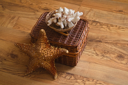 Basket with sea star and seashells for backgroundの写真素材
