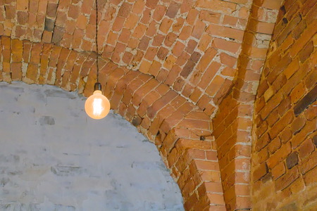 Club lighting in vintage style illuminates brick vaulted ceilingの写真素材