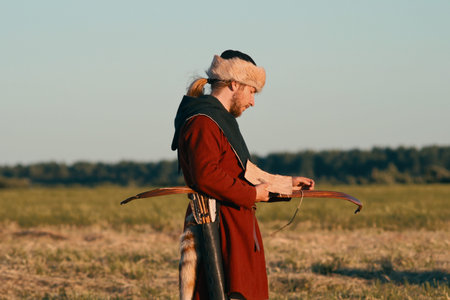 STARAYA LADOGA, RUSSIA -06.23.2019: Festival of historical reconstruction. Medieval Archer checks aunt before shooting at targets.のeditorial素材