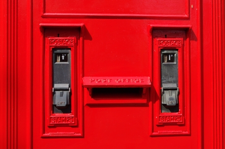 Old UK Post Office stamp dispenserの写真素材