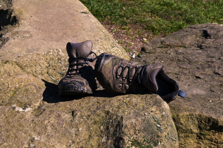 Old walking shoes on stone