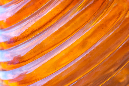 Ridged orange amber glass background.の写真素材