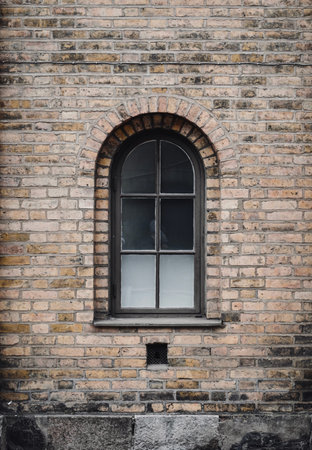 Photo of an old stone brick wall and a window