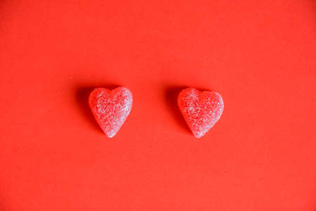 Photo of red jelly candy hearts on red backgroundの写真素材