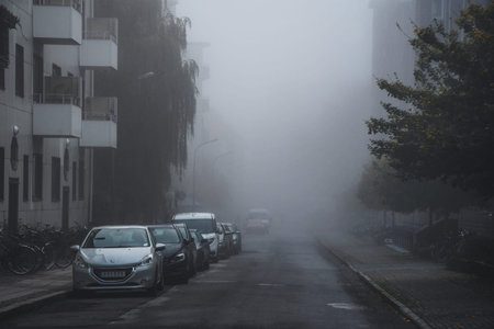 Photo of a street in a city or town while foggy weatherの写真素材