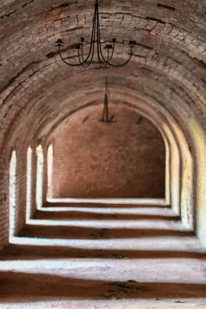 Photo of a room with archways inside a building, light and shadowの写真素材