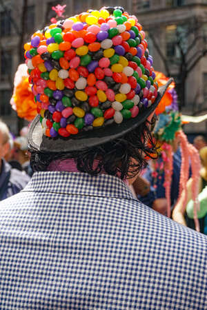New York, New York: Young man wearing a jelly bean bowler attends the Fifth Avenue Easter Parade.のeditorial素材