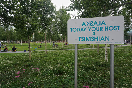 Anchorage, Alaska: A sign greets visitors as children relax on the lawn of the Anchorage Museum.