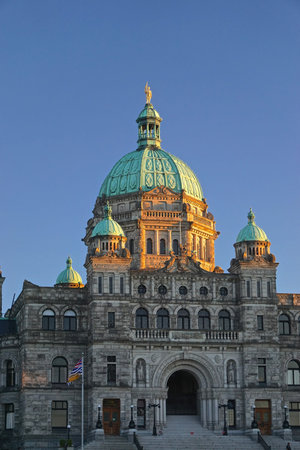 Victoria, British Columbia, Canada: The Neo-Baroque architecture of the British Columbia Parliament Buildings (1897), at sunset.のeditorial素材