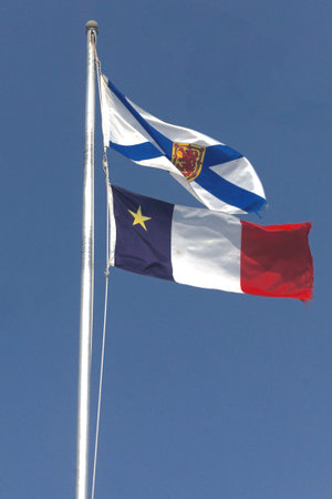 Cheticamp, Cape Breton, Nova Scotia, Canada: Flags of Nova Scotia, top, and Acadia, bottom, waving...