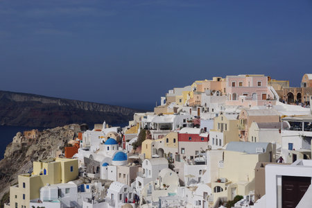Oia, Santorini, Greece: A cluster of houses, churches, and shops overlook the caldera on the Aegean...
