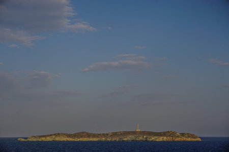 Syros, Greece: The Gaidaros Lighthouse, on Didimi Island off the coast of the Aegean island of...