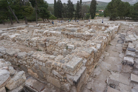 Knossos, Crete, Greece: Tourists explore the ruins at the Knossos Palace, an archaeological site on...