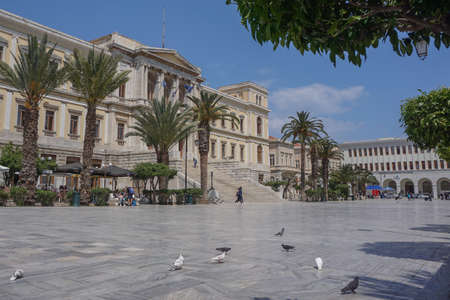 Syros, Greece: Palm trees line the front of  the Ermoupoli (Hermoupolis) City Hall in Miaouli Square, on the Aegean island of Syros.のeditorial素材