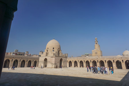 Cairo, Egypt: Tourists visit the Mosque of Ibn Tulun (879 AD) -- the oldest in Cairo surviving in...