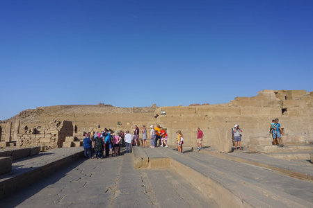 Kom Ombo, Egypt: Tourists and guides visit Kom Ombo Temple, a unique double temple built during the Ptolemaic dynasty, 180-47 BC.のeditorial素材
