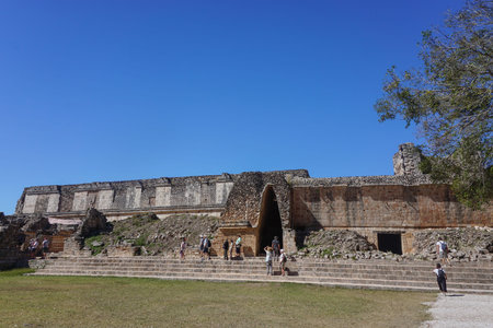 Uxmal, Mexico: Tourists visit the North Residential Plaza at the ancient Mayan ruins of Uxmal.のeditorial素材