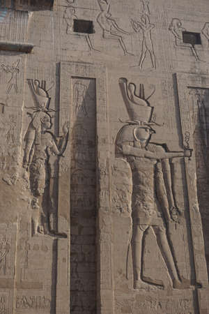 Edfu, Egypt: Detail of carvings on the first pylon of the temple of Edfu, the largest temple dedicated to Horus and Hathor of Dendera.のeditorial素材