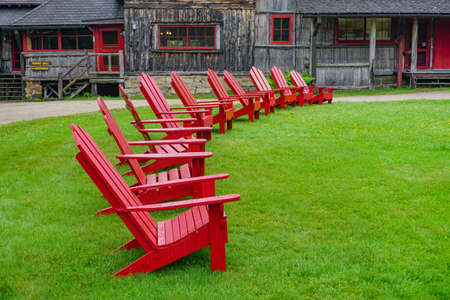 Sagamore Lake, NY: A row of Adirondacks chairs on the lawn at the Great Camp Sagamore, built in 1897.のeditorial素材