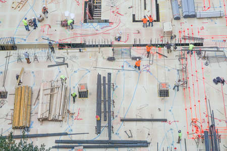 New York, New York: Aerial view of men and materials during construction of a new high-rise apartment building in midtown Manhattan, New York City.のeditorial素材