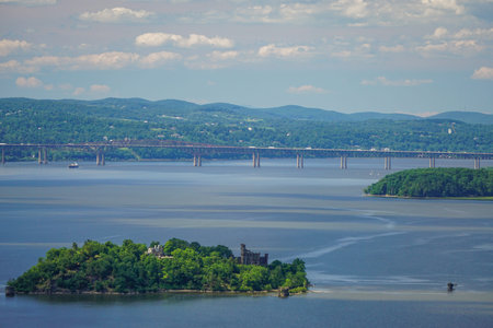 Orange Co., New York, USA: Bannerman's Castle, an abandoned military warehouse, on Pollepel Island in the Hudson River; and the Newburgh-Beacon Bridge.の写真素材