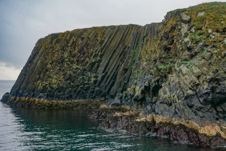 Stykkisholmur, Iceland: Columnar basalt rock formation of a small island in the waters of the Breidafjordur, created by volcanic eruption.の写真素材