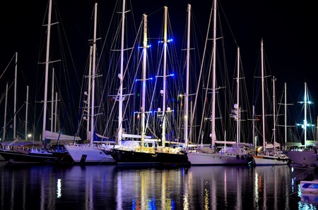 Night scene in a marina with moored yachts, in Marmaris, Turkeyの写真素材