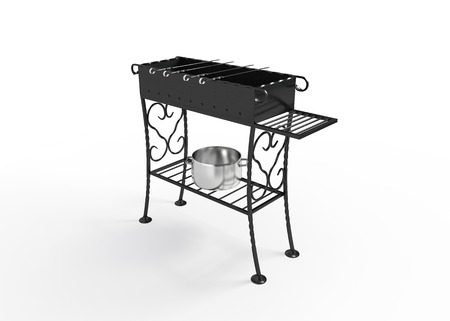 Black steel grill with wrought iron elements and skewersの写真素材