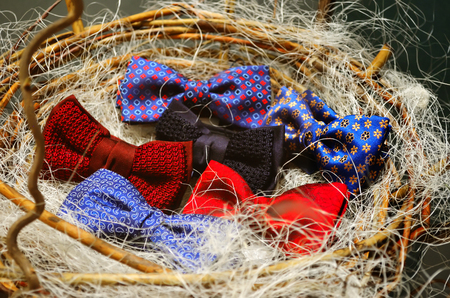 Bow ties are in the basket in the shop windowの写真素材