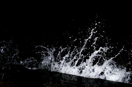 Splashing wave on the Black sea in the night.の写真素材