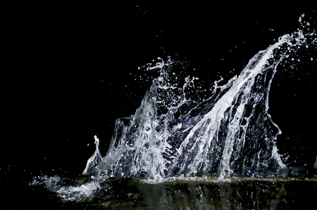 Splashing wave on the Black sea in the night.の写真素材