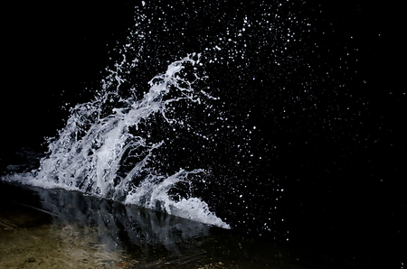Splashing wave on the Black sea in the night.の写真素材