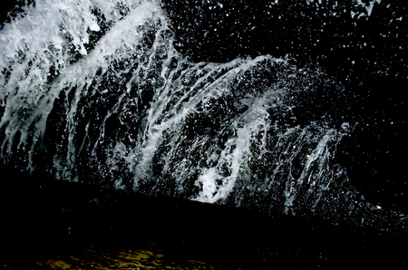 Splashing wave on the Black sea in the night.の写真素材