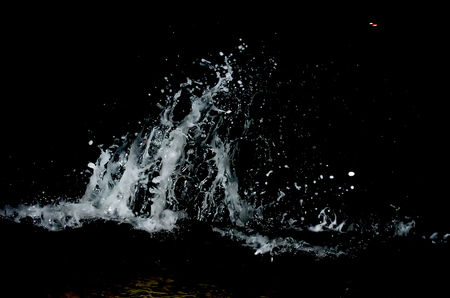 Splashing wave on the Black sea in the night.の写真素材