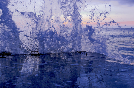 Splashing wave on the Black sea in the night.の写真素材