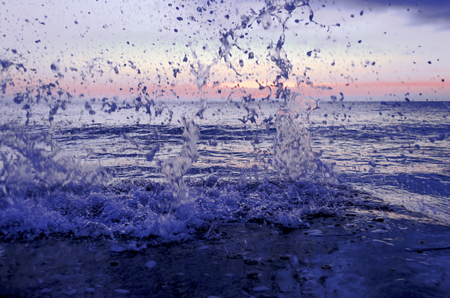 Splashing wave on the Black sea in the night.の写真素材