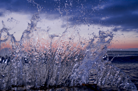 Splashing wave on the Black sea in the night.の写真素材