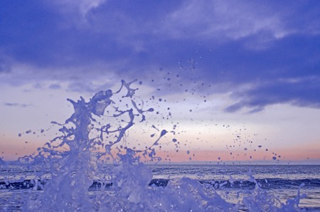Splashing wave on the Black sea in the night.の写真素材
