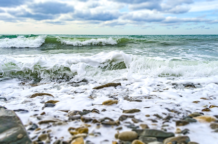 A strong wind rolls the waves to the shore on the Black sea.の写真素材