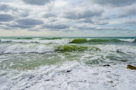 A strong wind rolls the waves to the shore on the Black sea.の写真素材