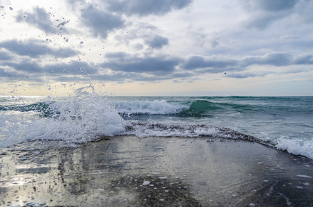 Splashing wave on the Black sea in the sunny day.の写真素材