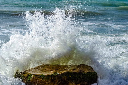 Splashing wave on the Black sea in the day.