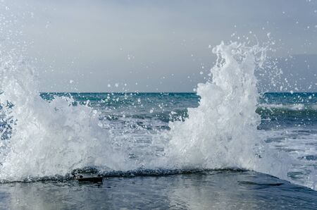 Splashing wave on the Black sea in the day.の写真素材