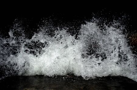 Splashing wave on the Black sea in the night.の写真素材